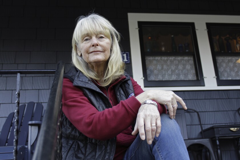 Susan Crowley, 75, sits outside her home in Hood River, Ore.