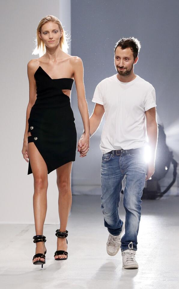 Designer Anthony Vaccarello, right, with a model