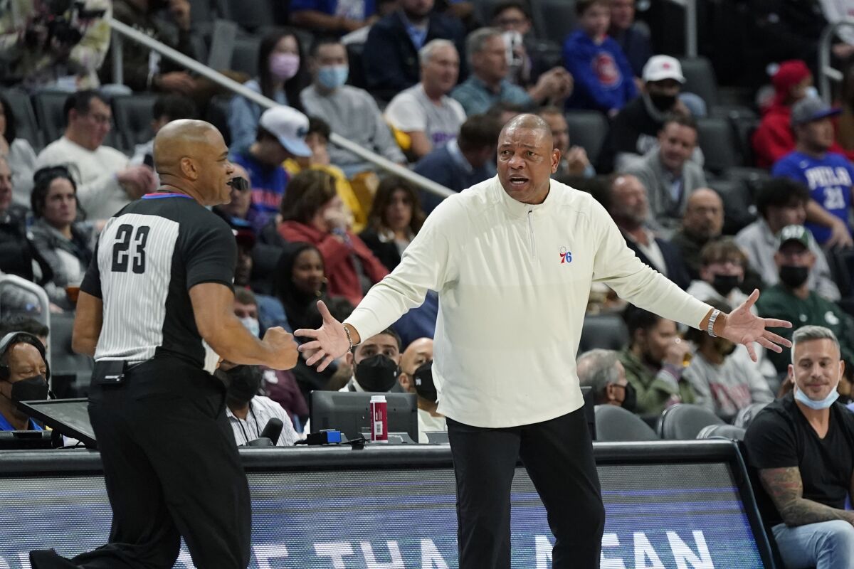 Philadelphia 76ers head coach Doc Rivers looks towards referee Tre Maddox during the second half of an NBA basketball game against the Detroit Pistons, Thursday, Nov. 4, 2021, in Detroit. (AP Photo/Carlos Osorio)