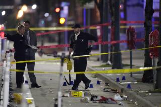 Denver Police Department investigators work the scene of a mass shooting along Market Street between 20th and 21st avenues during a celebration after the Denver Nuggets won the team's first NBA Championship early Tuesday, June 13, 2023, in Denver. (AP Photo/David Zalubowski)