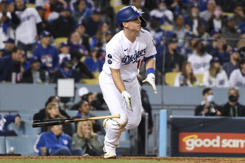 Dodgers' Will Smith tosses his bat after hitting a two-run home run.