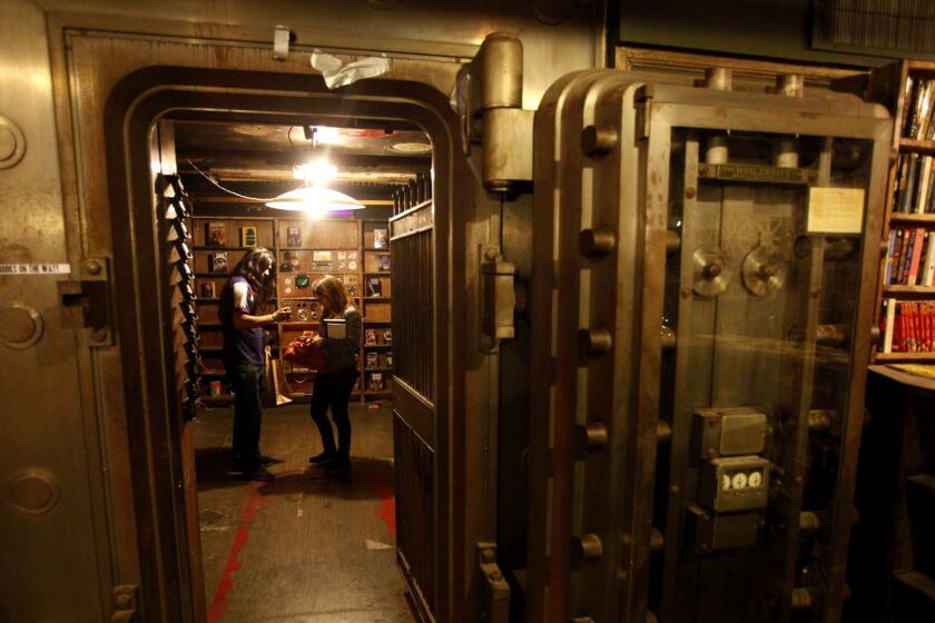 LOS ANGELES, CA - JANUARY 31, 2013 -- A couple spend time in the science fiction room housed inside an old bank vault as part of, "The Labyrinth," which can be found on the second floor of The Last Bookstore in downtown Los Angeles on January 31, 2013. (Photo by Genaro Molina/Los Angeles Times)