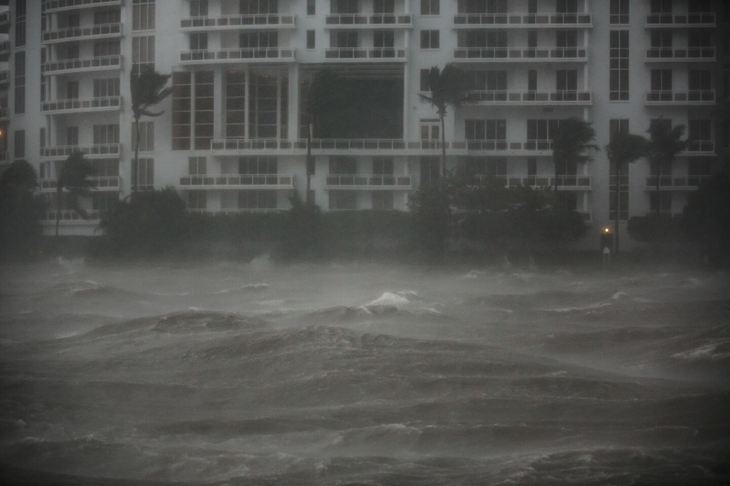 The waves on the Miami River begin to surge Sunday as winds pick up speed upon Hurricane Irma's approach.