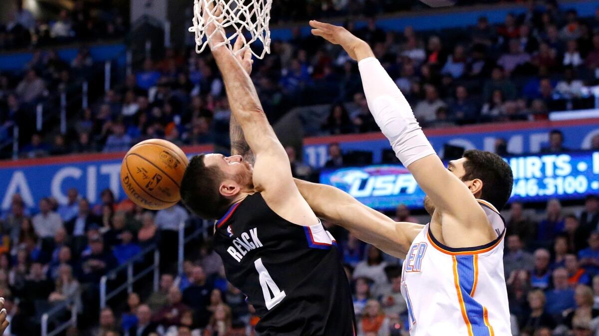 Thunder center Enes Kanter blocks a shot by lippers guard J.J. Redick during the third quarter Saturday night.