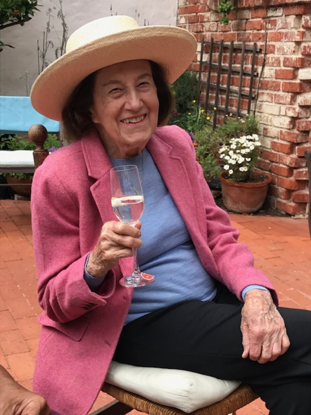 Lucienne Guillemin, who turns 100 on Feb. 18, enjoys wine daily with her husband at their home in La Jolla.