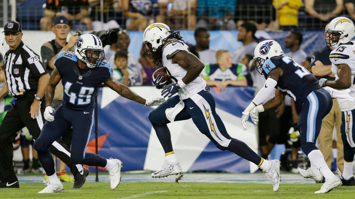The Chargers' Melvin Gordon runs toward the end zone against Tennessee's Alex Ellis (49) and David Fluellen on Aug. 13, 2016.