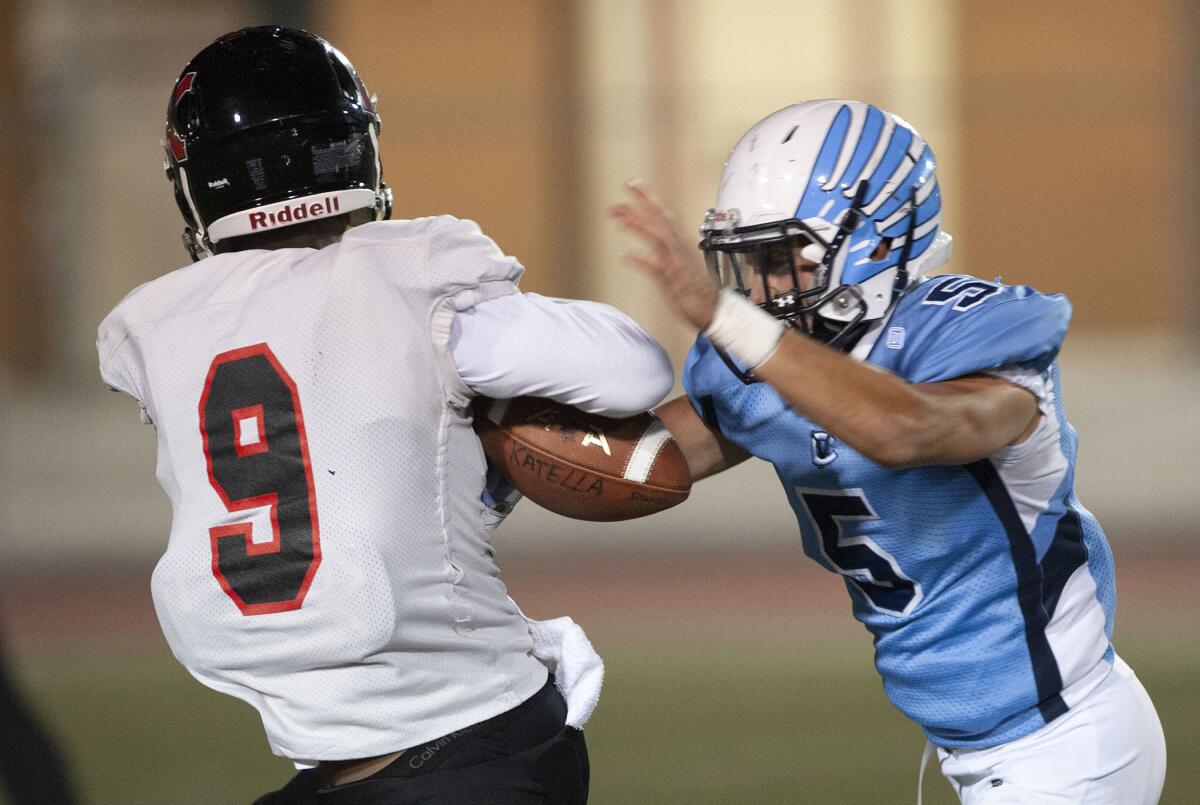 Crescenta Valley’s Vinny Parrott tries to break up a pass to Katella’s Keyshawn Tresvant during Friday's CIF Southern Section Division X semifinal playoff game at Moyse Field. (Photo by Miguel Vasconcellos)