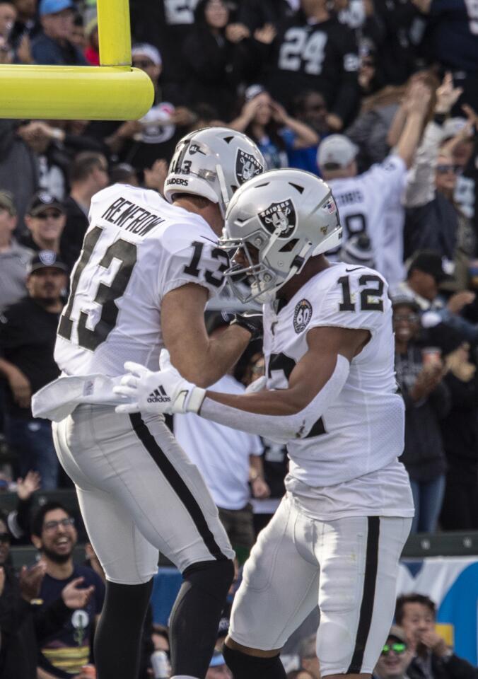 Oakland Raiders wide receiver Hunter Renfrow, left, celebrates with teammate Zay Jones after scoring a touchdown.