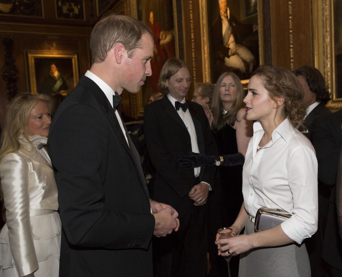 Prince William speaks with "Harry Potter" star Emma Watson at a Windsor Castle dinner celebrating the work of the Royal Marsden Hospital.