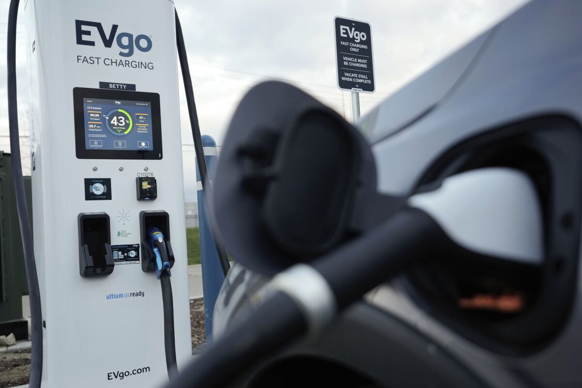 An electric vehicle charges at an EVgo fast charging station in Detroit. 