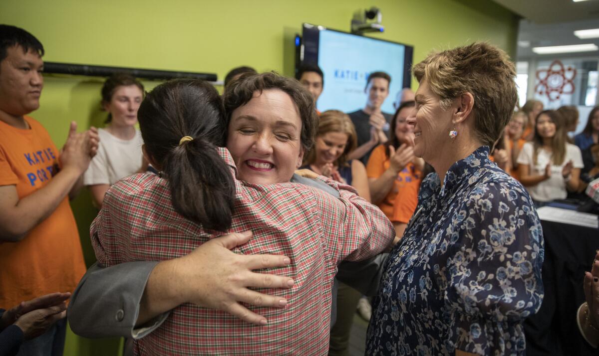 Democratic Rep.-elect Katie Porter is congratulated by volunteers at her campaign headquarters in Irvine.