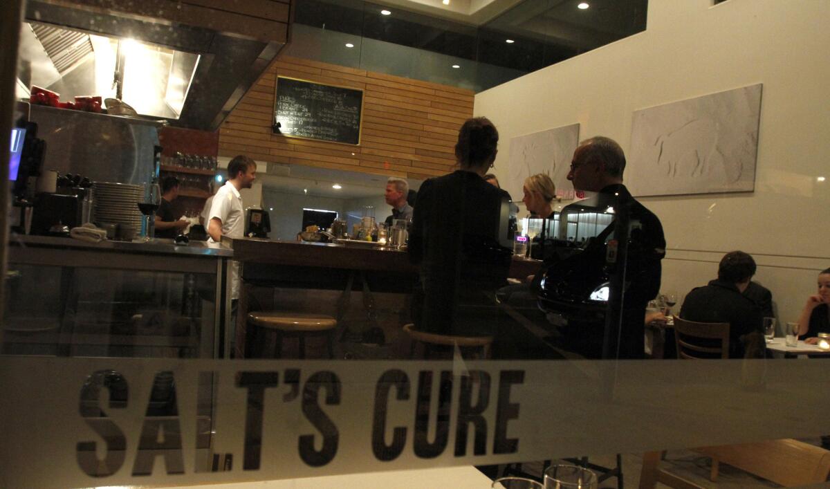 A crowd gathers at Salt's Cure in West Hollywood on Dec. 16, 2010. The restaurant is moving to Hollywood in the fall.