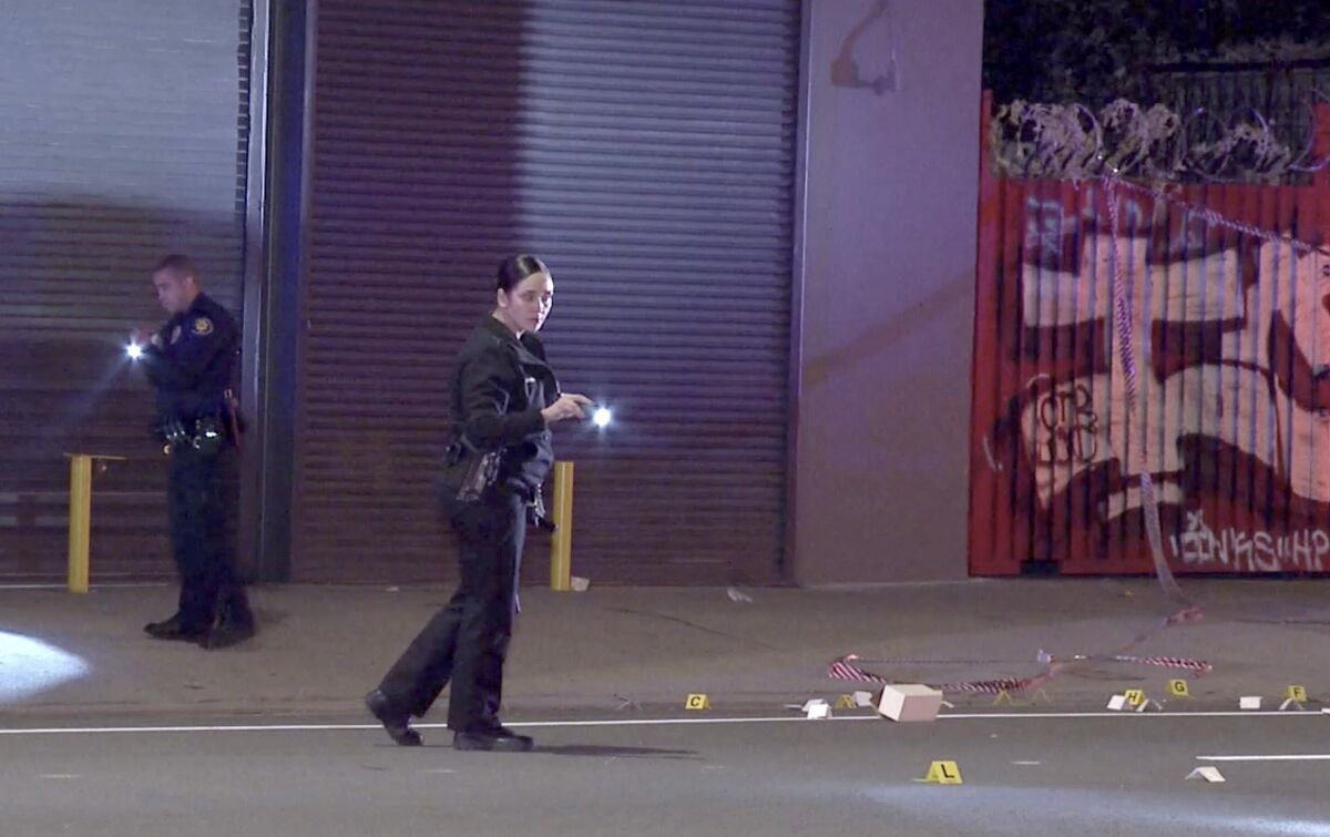 LAPD officers investigate a shooting at an underground nightclub in South L.A.