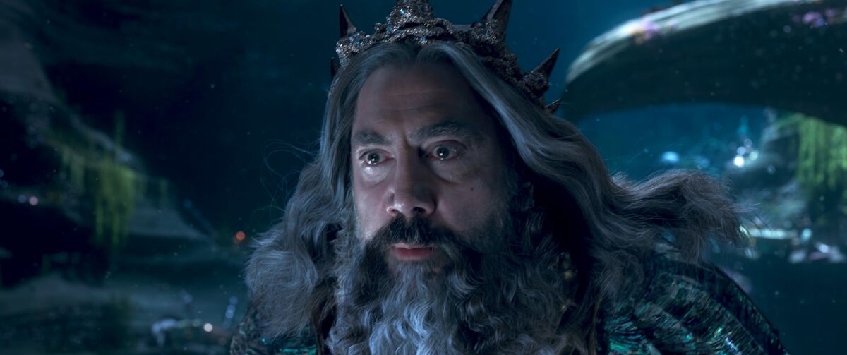 Javier Bardem wears a long beard as Triton in the movie "The Little Mermaid."
