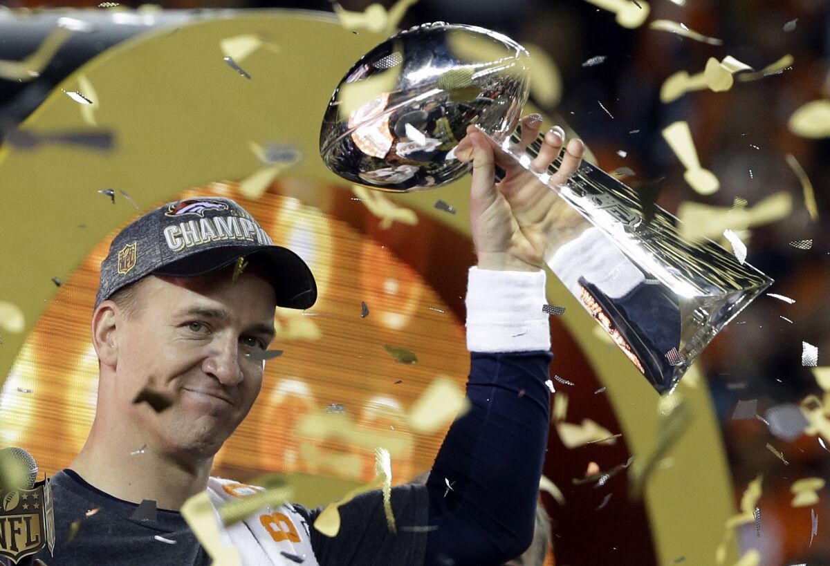 FILE - In this Feb. 7, 2016, file photo, Denver Broncos quarterback Peyton Manning holds up the Vince Lombardi Trophy after the Broncos defeated the Carolina Panthers 24-10 in NFL football's Super Bowl 50 in Santa Clara, Calif. Peyton Manning never wanted to leave Indianapolis. But when a neck injury forced him to miss a season and the Colts moved on to Andrew Luck, he couldn’t have landed in a better place than Denver, where he produced a terrific second chapter to his Hall of Fame career. (AP Photo/Julie Jacobson, File)