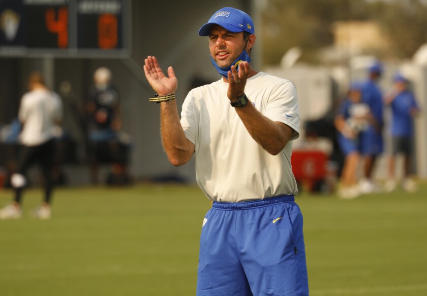 Rams defensive coordinator Brandon Staley applauds the defense during practice.