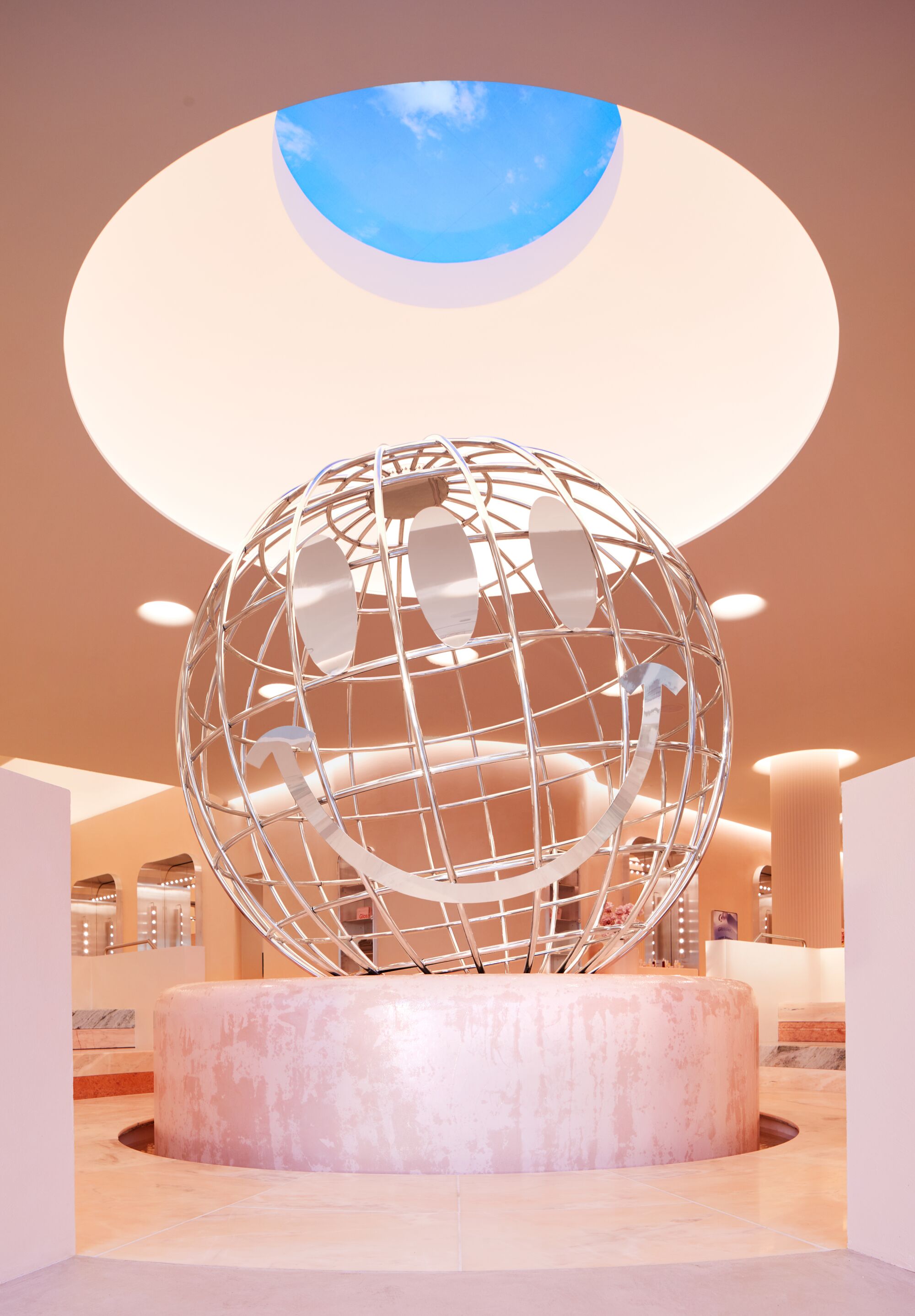 A metal globe under a dome ceiling.