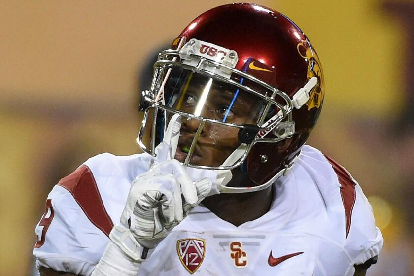 USC's Juju Smith-Schuster signals to the crowd after scoring against Arizona State on Saturday.