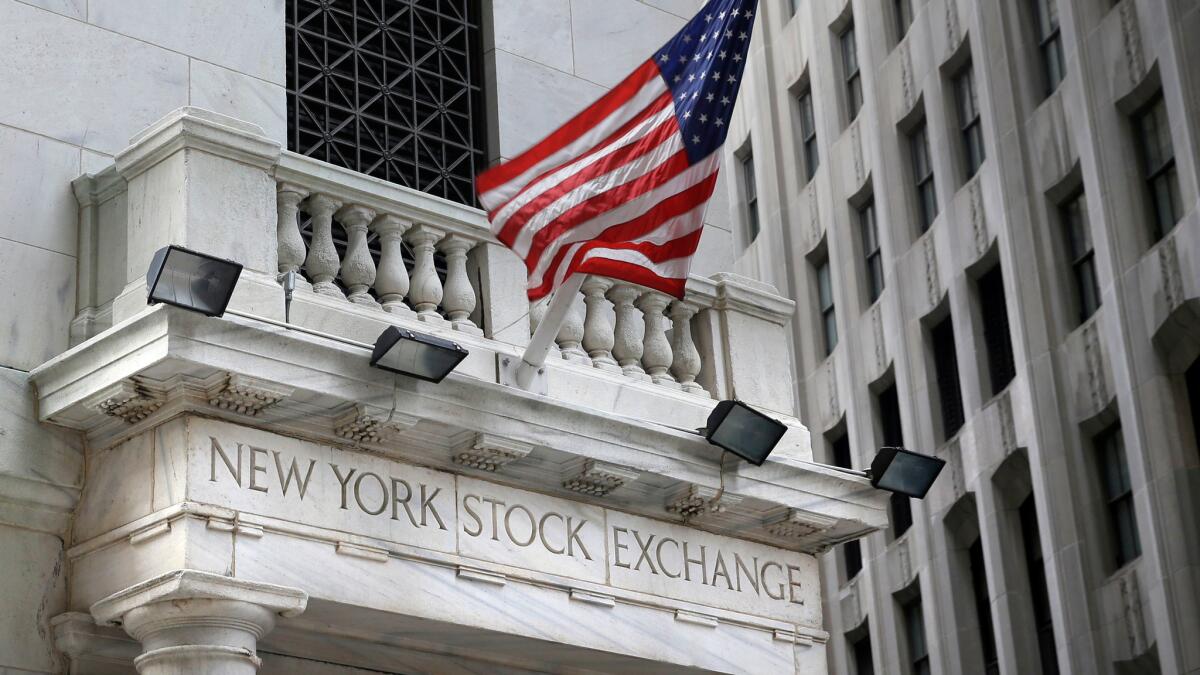 A U.S. flag flies from the New York Stock Exchange building.