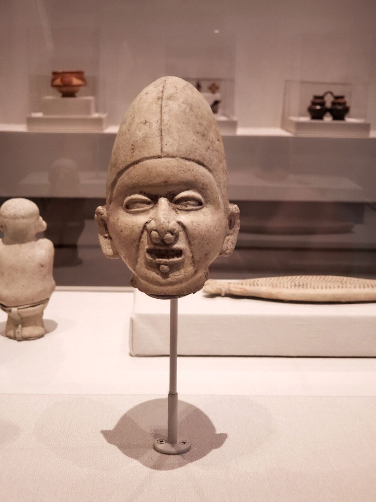A clay figure of a face.