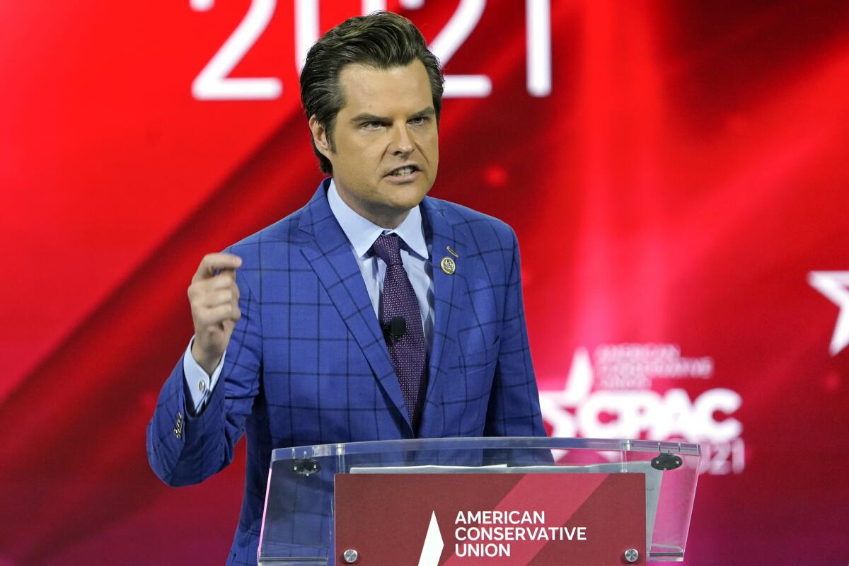 Rep. Matt Gaetz speaking from an American Conservative Union lectern, with CPAC logos in the background