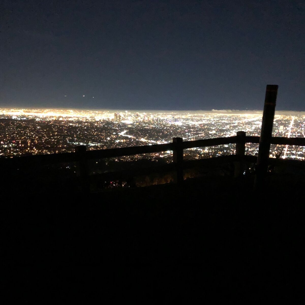The bright-city night view of Los Angeles from the top of Mt. Hollywood.