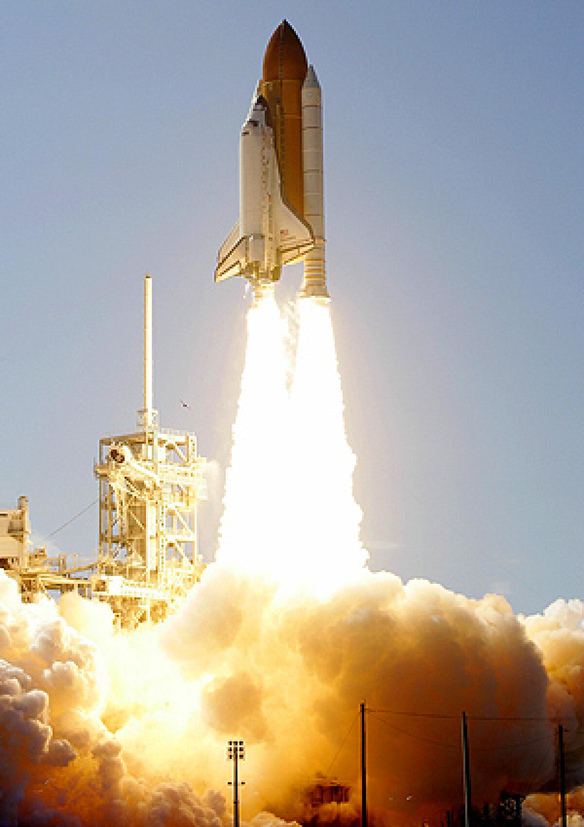 Space Shuttle Discovery lifts off from pad 39A at the Kennedy Space Center in Cape Canaveral, Fla.