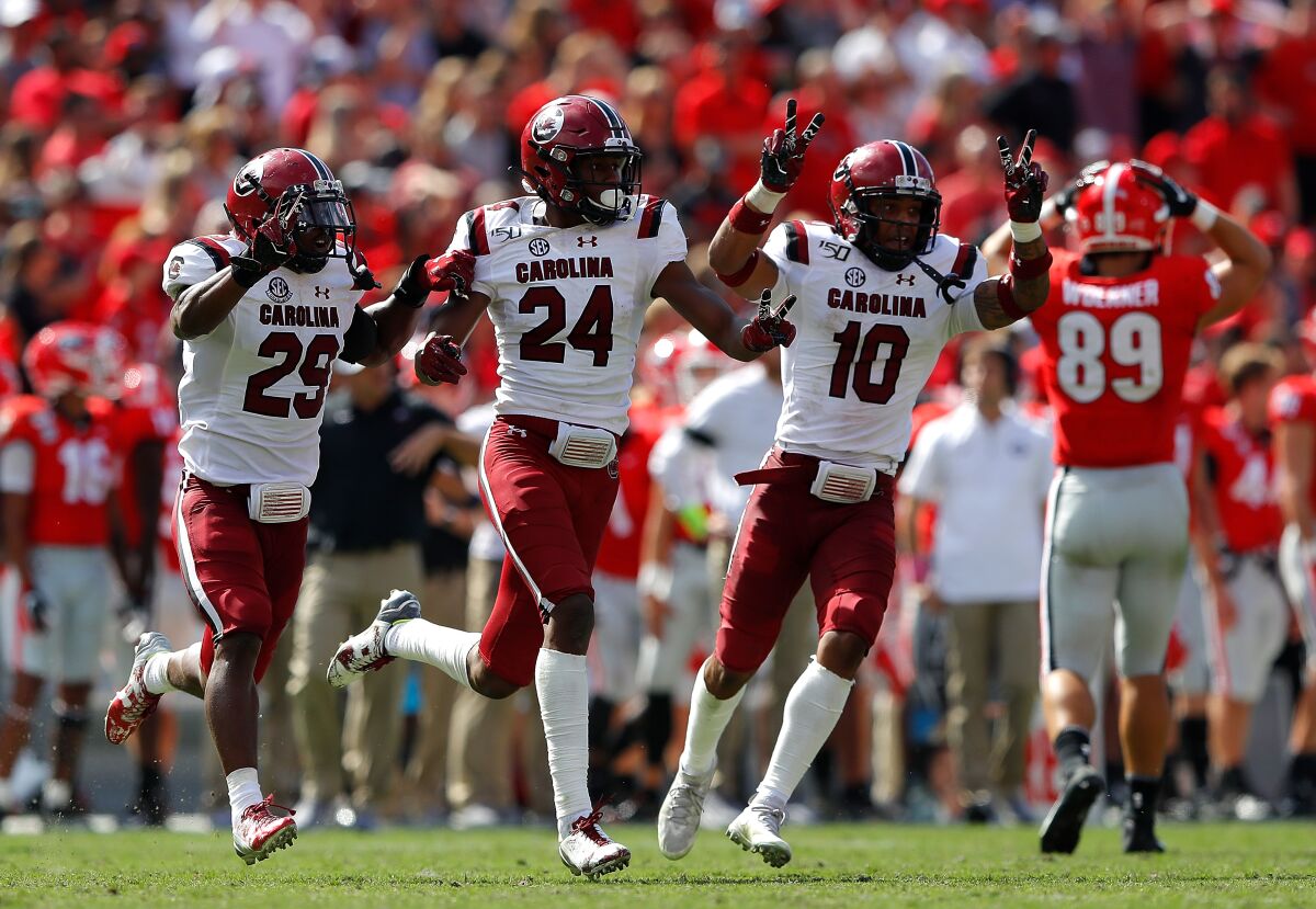 South Carolina's Israel Mukuamu (24) reacts after his second interception of the game against Georgia in the second half of their 20-17 double-overtime win on Saturday in Athens, Ga.
