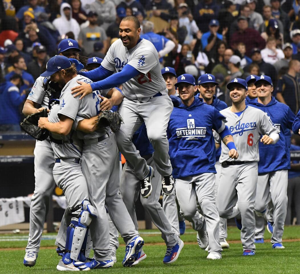 Dodgers celebrate after capturing game seven of the National League Championship Series against the Milwaukee Brewers at Miller Park.