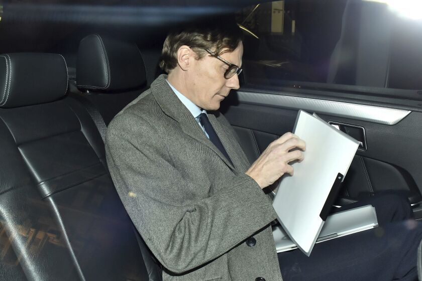 FILE - In this Tuesday March 20, 2018 file photo, Alexander Nix, chief executive of Cambridge Analytica, leaves his offices in central London. Documents released to The Associated Press in September 2020 from Brittany Kaiser, a former Cambridge Analytica insider, reveal what an election watchdog group claims was illegal coordination between Donald Trump’s 2016 presidential campaign and a pro-Trump PAC largely financed by billionaire Robert Mercer. On Thursday, Oct. 15, 2020, Nix’s attorney Kory Langhofer said his client had no knowledge of what is described in the complaint. (Dominic Lipinski/PA via AP)