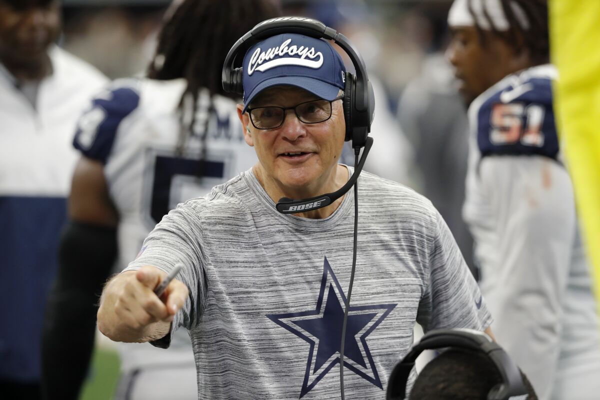 FILE - In this Sept. 22, 2019, file photo, Dallas Cowboys defensive coordinator Rod Marinelli talks to players on the sideline during the second half of an NFL football game against the Miami Dolphins in Arlington, Texas. Now with the Las Vegas Raiders, the 71-year-old war veteran known for his salty language on the practice field could be one of the team's most important offseason additions. (AP Photo/Roger Steinman, File)