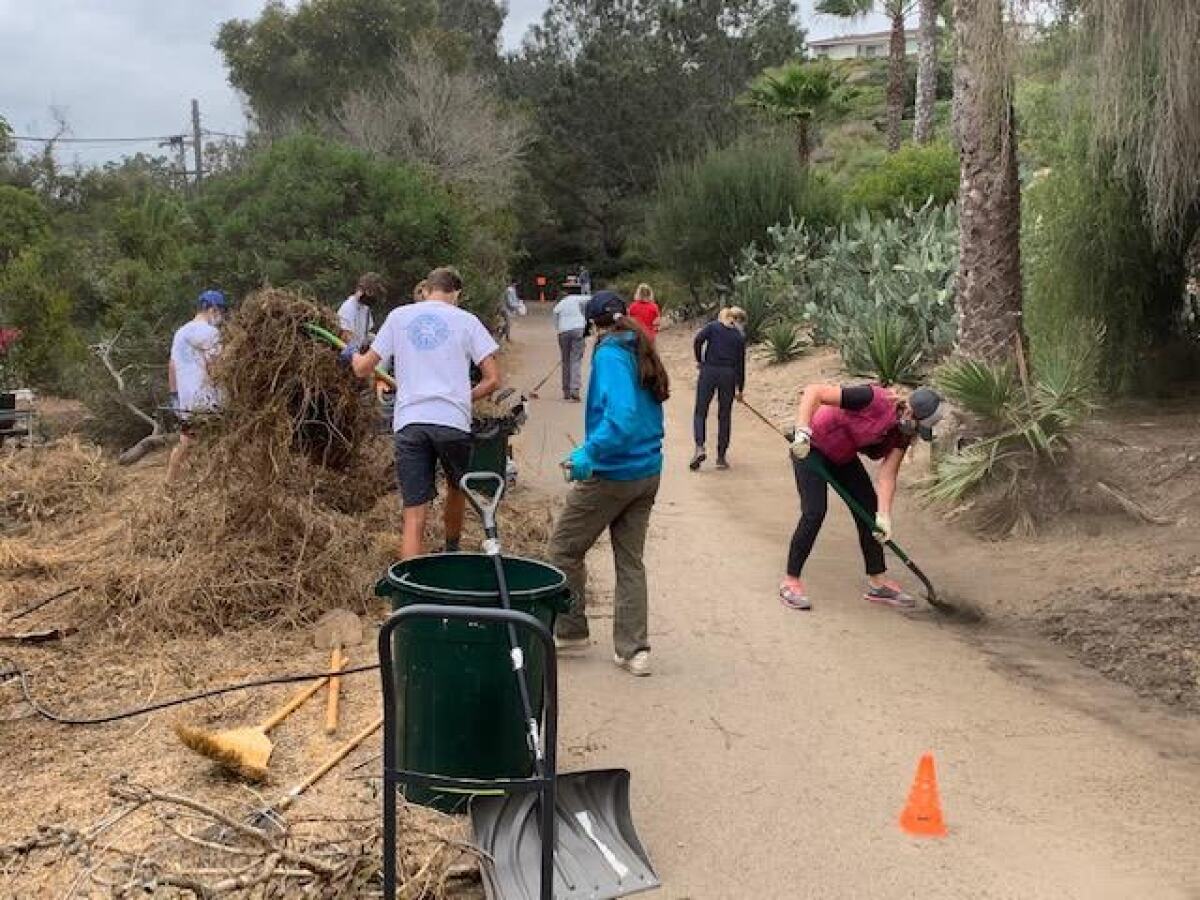 Volunteers clean up the La Jolla Bike Path in 2020. The cleanup will repeat Saturday, Oct. 23.
