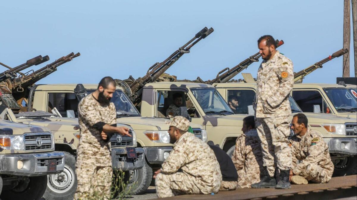 Forces loyal to Libya's U.N.-backed unity government arrive in a suburb of the capital, Tripoli, on Saturday.