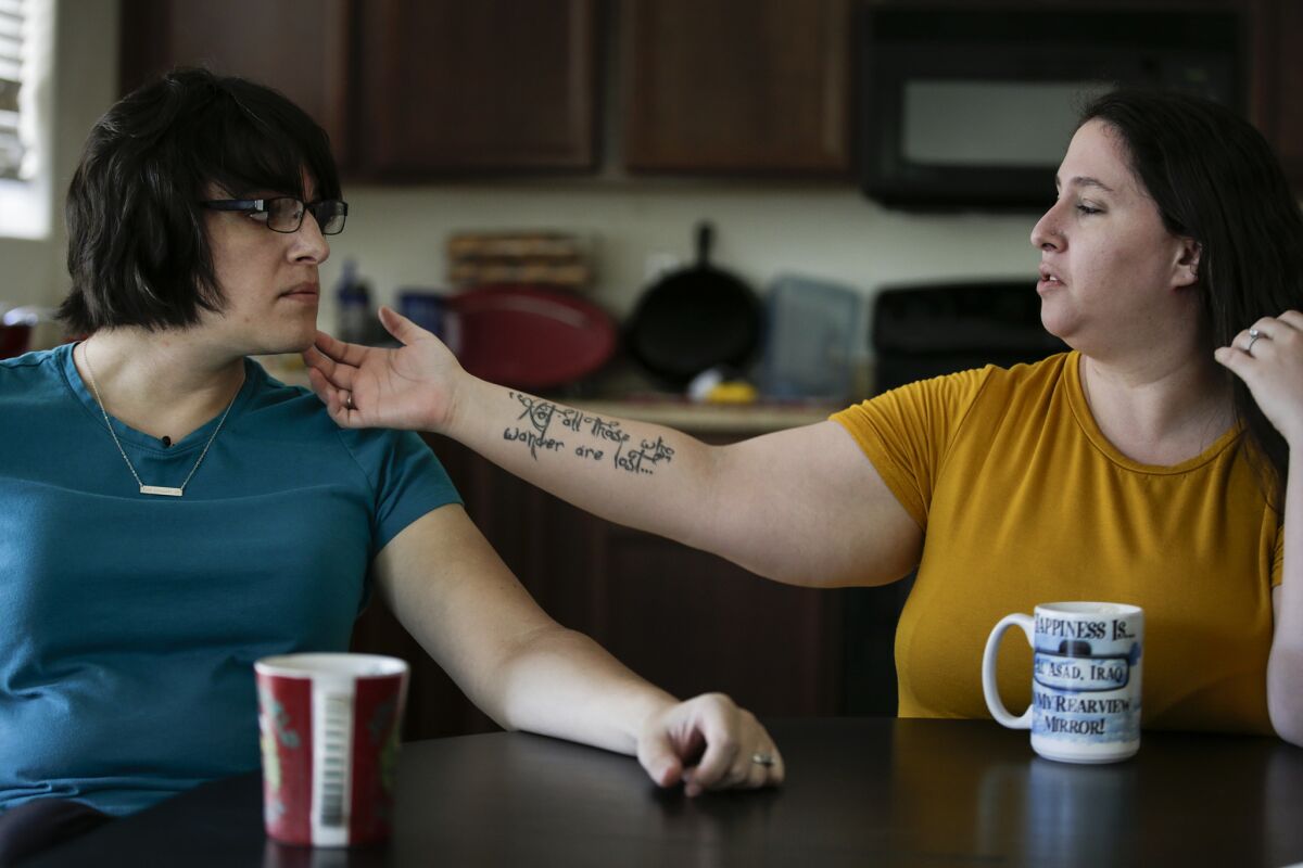 During the Aurora shooting, Don Lader helped wife Jacqueline flee. Now Jacqueline, right, is protective of Ellie.