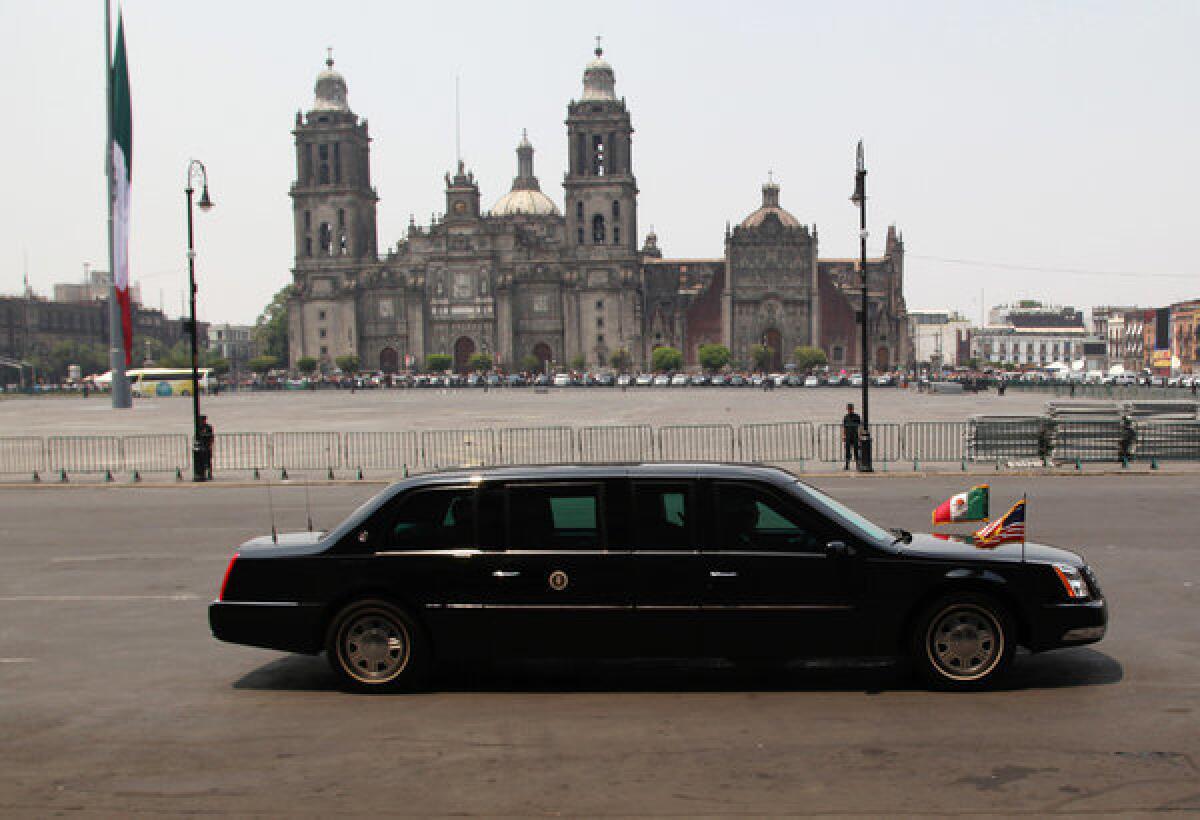 Obama's presidential limousine, nicknamed "The Beast," is driven past the Metropolitan Cathedral in Mexico City on Thursday.