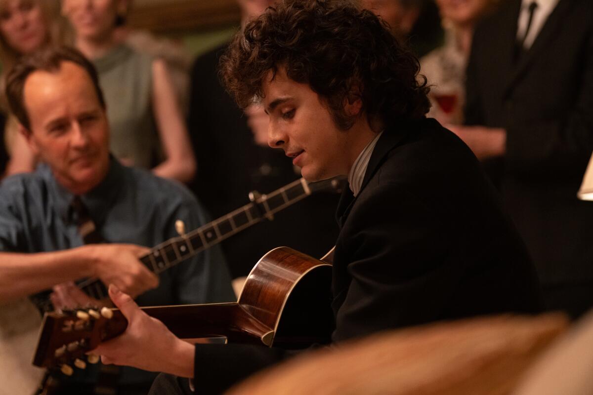 Edward Norton and Timothée Chalamet as Bob Dylan in "A Complete Unknown."