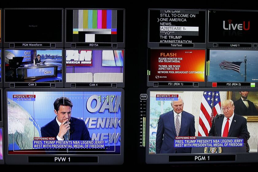 Screens show different segments for a nightly news segment in the control room at the San Diego based One America News on Sept. 5, 2019. Host, Patick Hussion is shown on the bottom left screen.