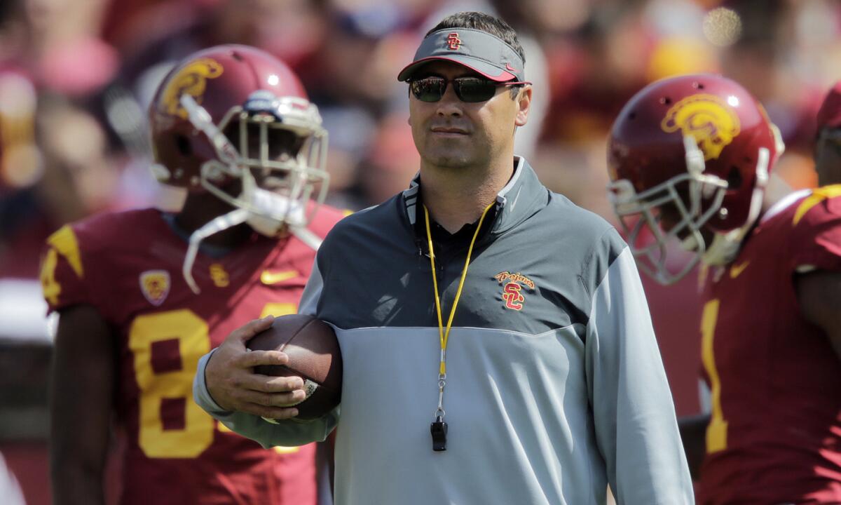 USC Coach Steve Sarkisian looks on before the start of the Trojans' spring game at the Coliseum on April 11.