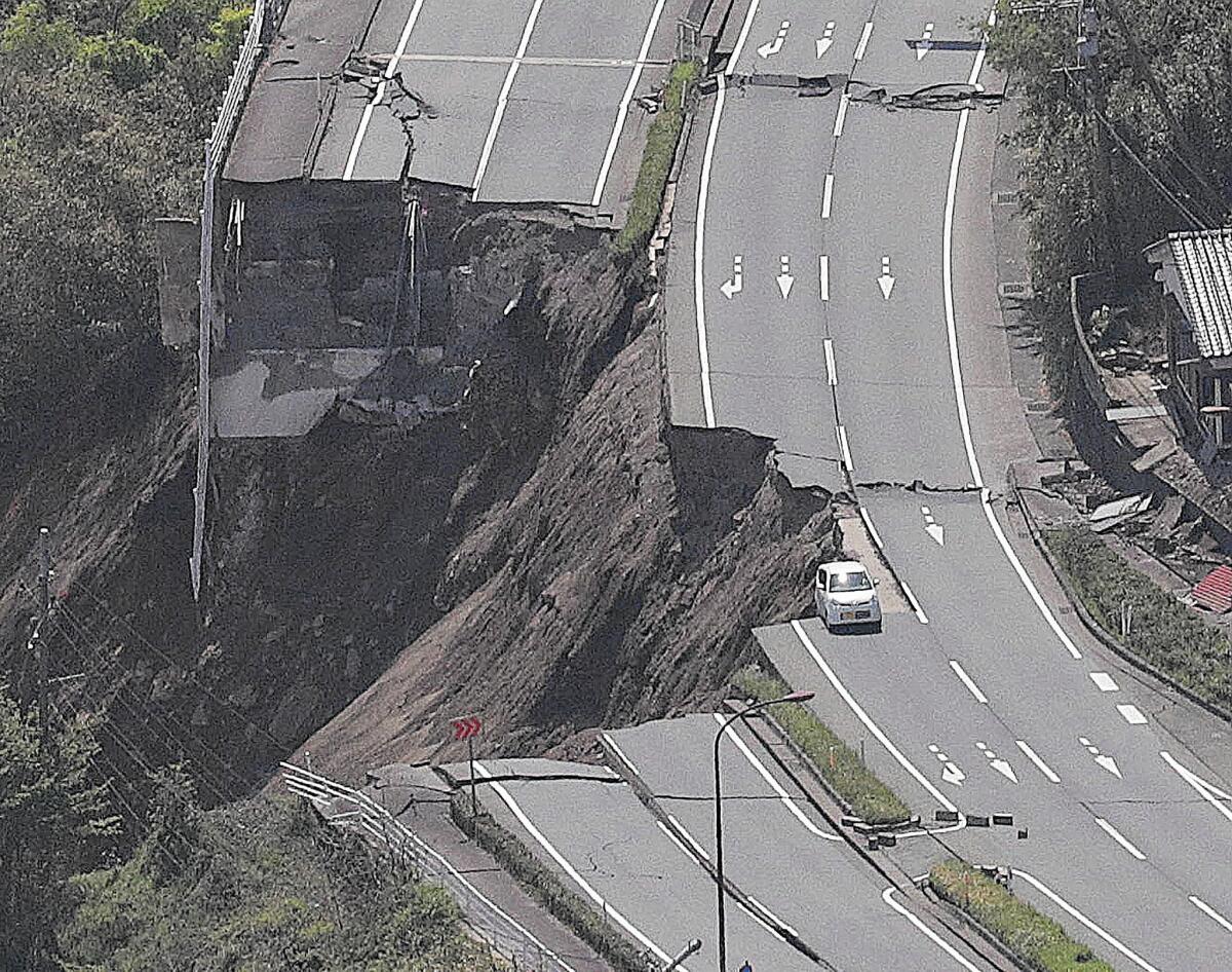 A road is severed after one of the earthquakes in Minamiaso, Japan.