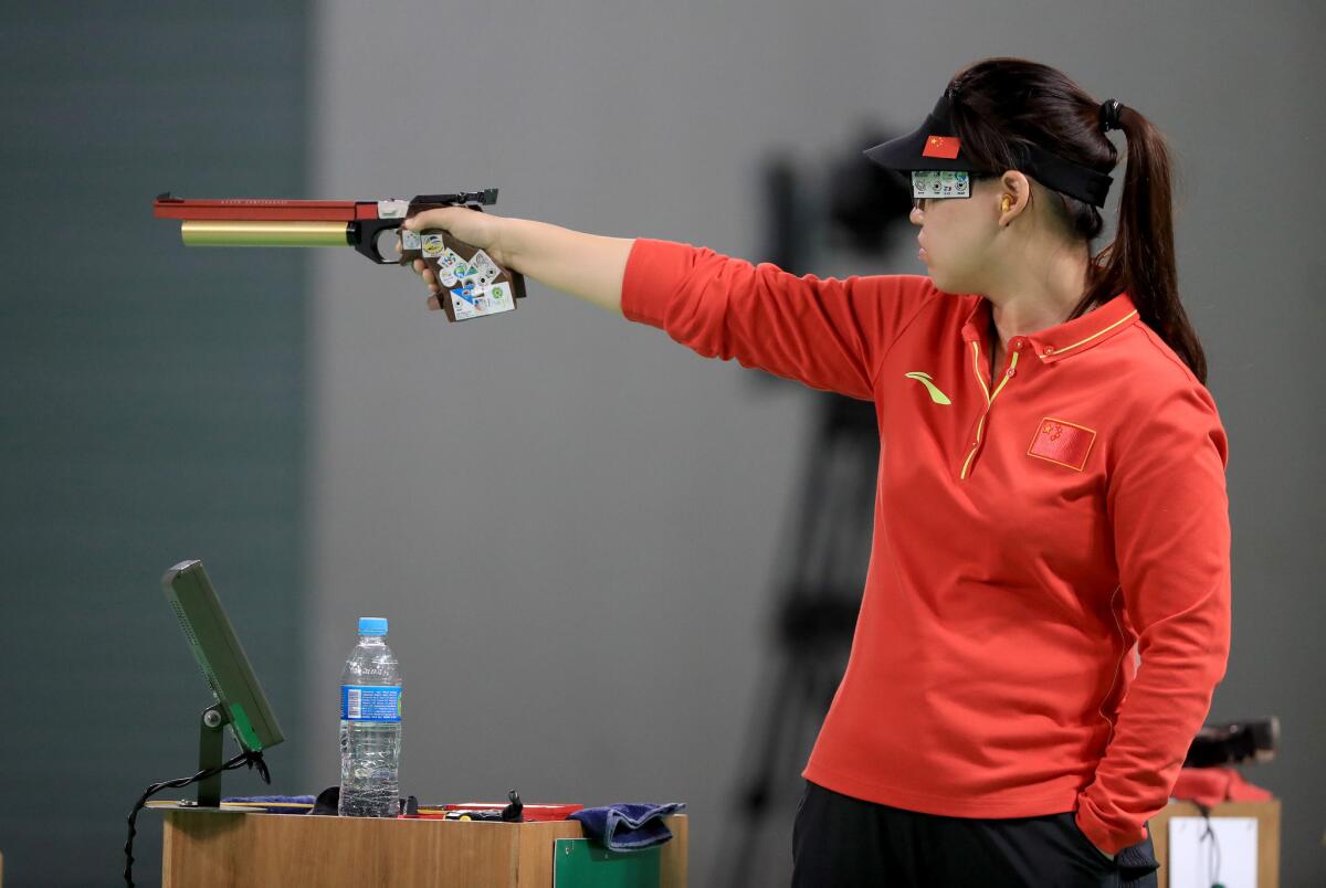 Zhang Mengxue of China competes during the women's 10-meter air pistol event.
