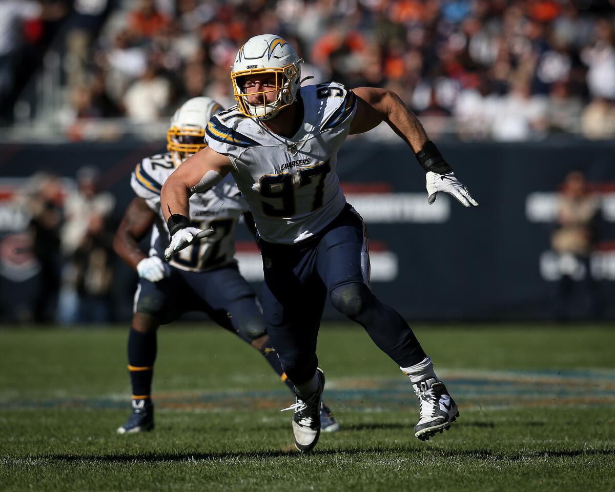 Joey Bosa chases after the ball.