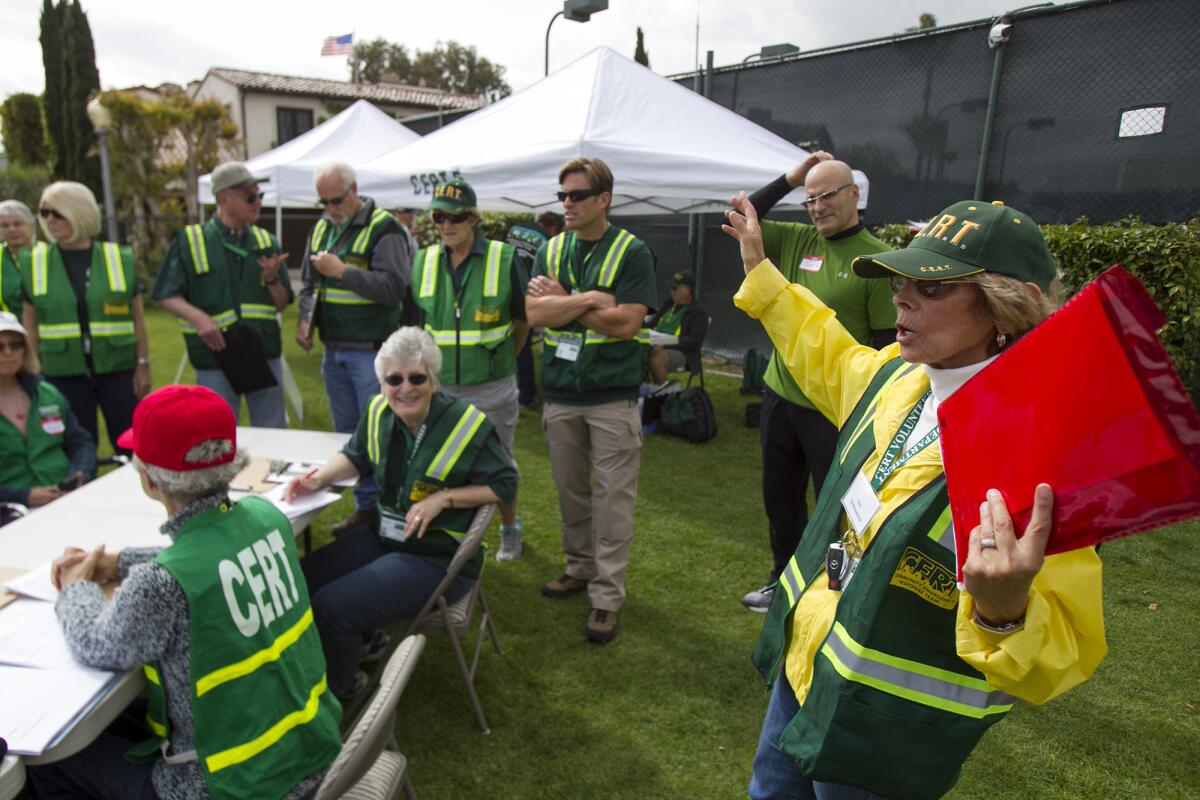 Gail Reisman, right, leads a group of Community Emergency Response Team volunteers at a command post on Lido Island during Newport Beach Fire Department's second annual neighborhood emergency preparedness drills on Saturday, April 25. The drill will simulate a 7.2 earthquake on the Newport-Inglewood fault.