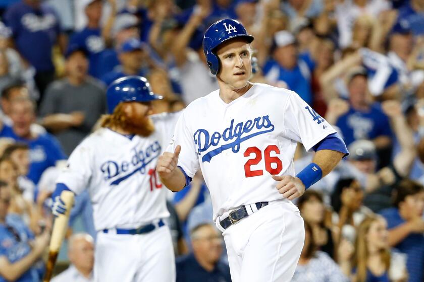 Dodger Chase Utley reacts after scoring in the seventh inning against the New York Mets on Saturday.