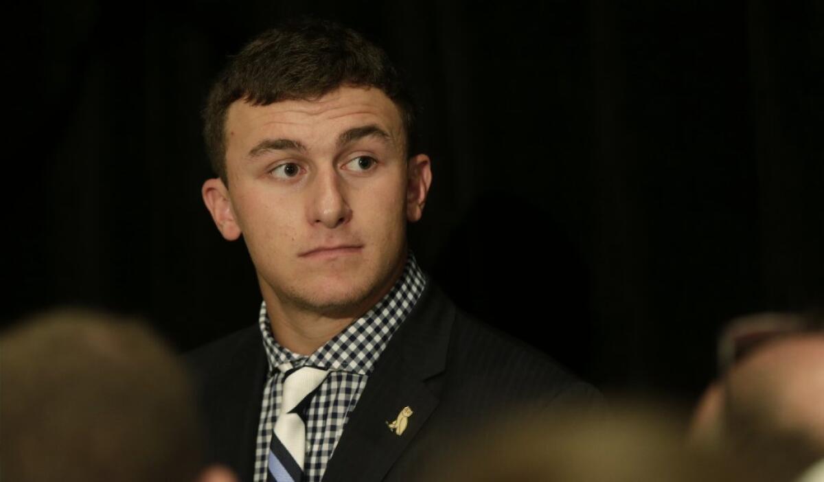 Texas A&M; quarterback Johnny Manziel talks with reporters July 17.