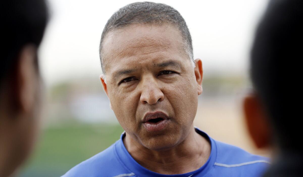 Los Angeles Dodgers Manager Dave Roberts talks to reporters after a spring training baseball workout on Friday.