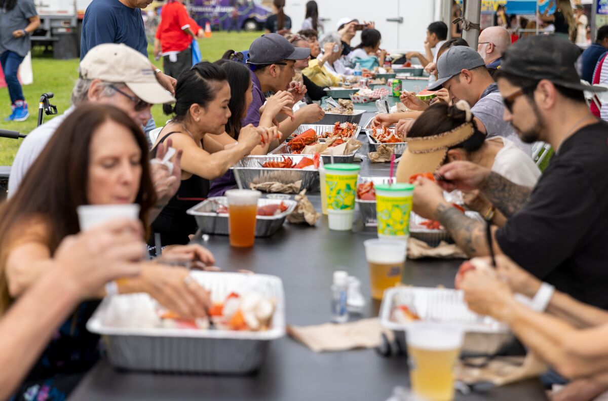 Crowds enjoy fresh Maine lobster at the Original Lobster Festival held at Fountain Valley Sports Park.