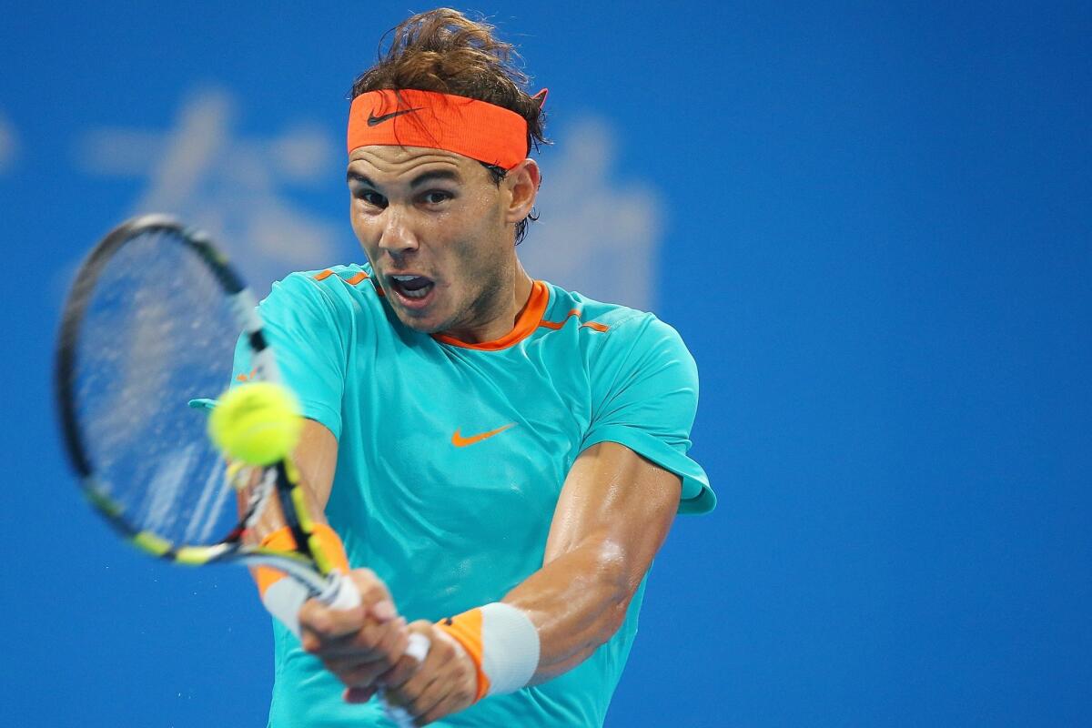 Rafael Nadal of Spain plays a backhand in his match against Martin Klizan of Slovakia during during day seven of the China Open on Oct. 3.