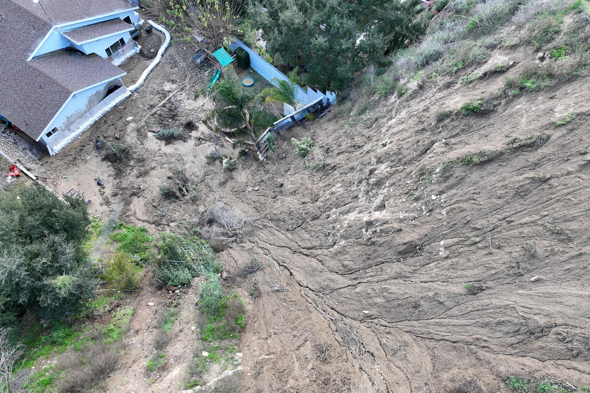 An aerial view where multiple mudslides damaged three homes Tuesday on Gotera Dr, in Hacienda Heights.