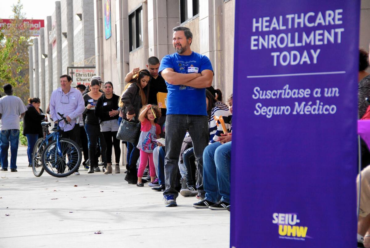 Increasing access to healthcare among Americans parallels a major expansion in health insurance coverage that began in 2014 through the health law often called Obamacare. Above, an Obamacare enrollment event in L.A. in November.