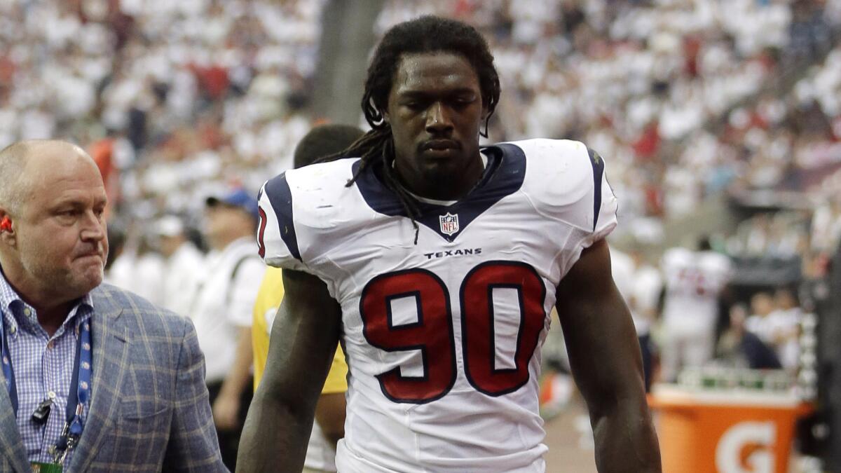 Houston's Jadeveon Clowney leaves Sunday's game against the Washington Redskins after suffering a knee injury.